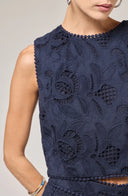 Navy blue lace dress on a neutral background